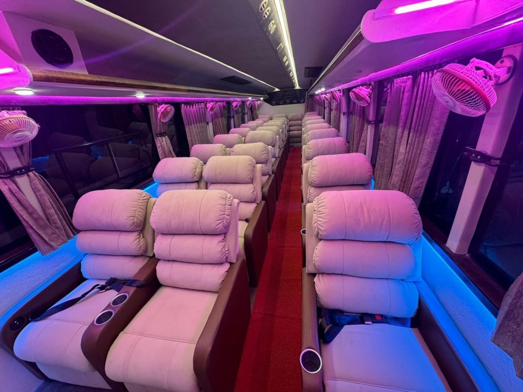 Ambient lighting inside the luxury sofa bus at night for a cozy and comfortable journey.