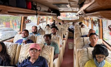 Passengers enjoying a scenic and comfortable drive from Kathmandu to Pokhara in a luxury sofa bus.