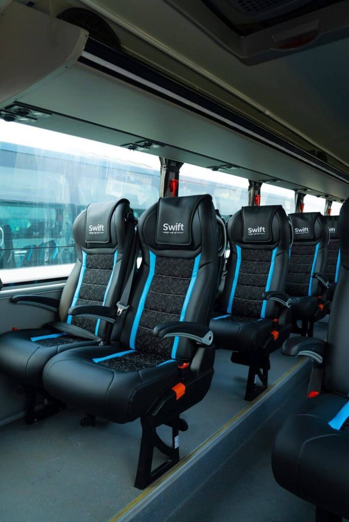 Interior view of a modern Volvo bus in Nepal showing comfortable seats and spacious layout.