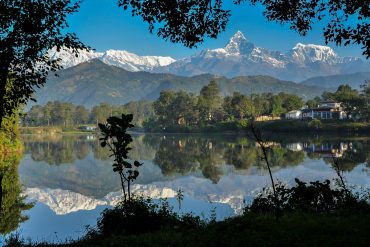 Pokhara city skyline with lakeside view and mountains, representing Nepal’s natural beauty and tourism.Beautiful Pokhara city showcasing the lakeside charm and Himalayan backdrop of Nepal.