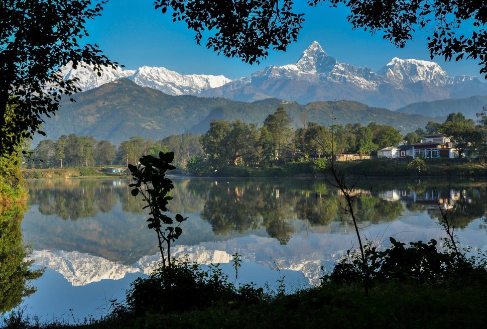 Pokhara city skyline with lakeside view and mountains, representing Nepal’s natural beauty and tourism.Beautiful Pokhara city showcasing the lakeside charm and Himalayan backdrop of Nepal.