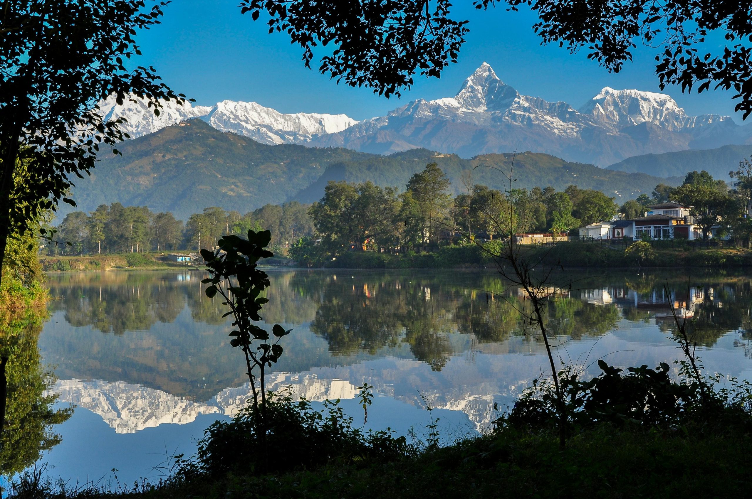 Pokhara city skyline with lakeside view and mountains, representing Nepal’s natural beauty and tourism.Beautiful Pokhara city showcasing the lakeside charm and Himalayan backdrop of Nepal.